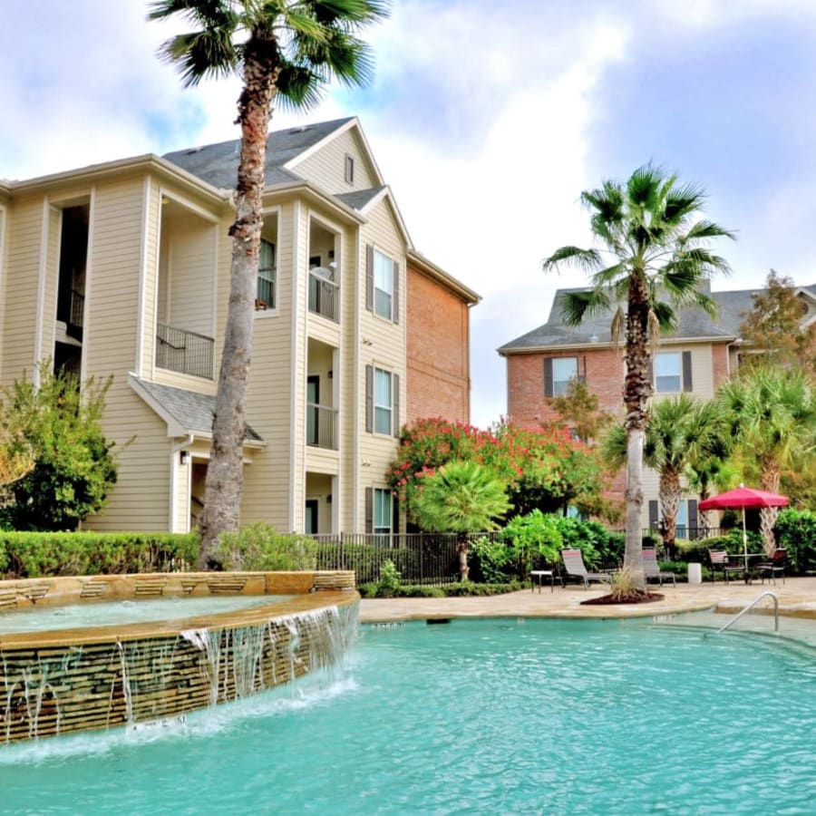 The community swimming pool at Compass at Windmill Lakes in Houston, Texas
