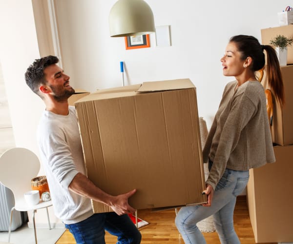 Couple Moving boxes to First Rate Storage