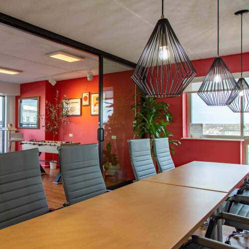 Conference room with modern pendant lighting at Station 101 in Beverly, Massachusetts