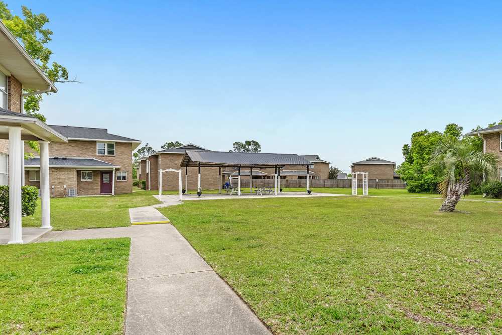 Exterior view of the property with pathway at Tyndall Pointe in Panama City, Florida