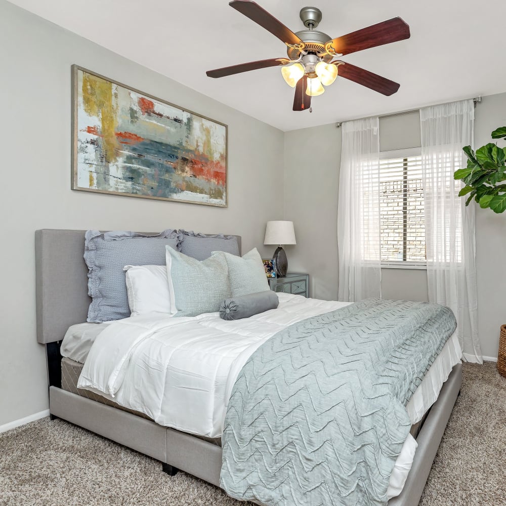 A bedroom with a large window for natural lighting at Barringer Square in Webster, Texas