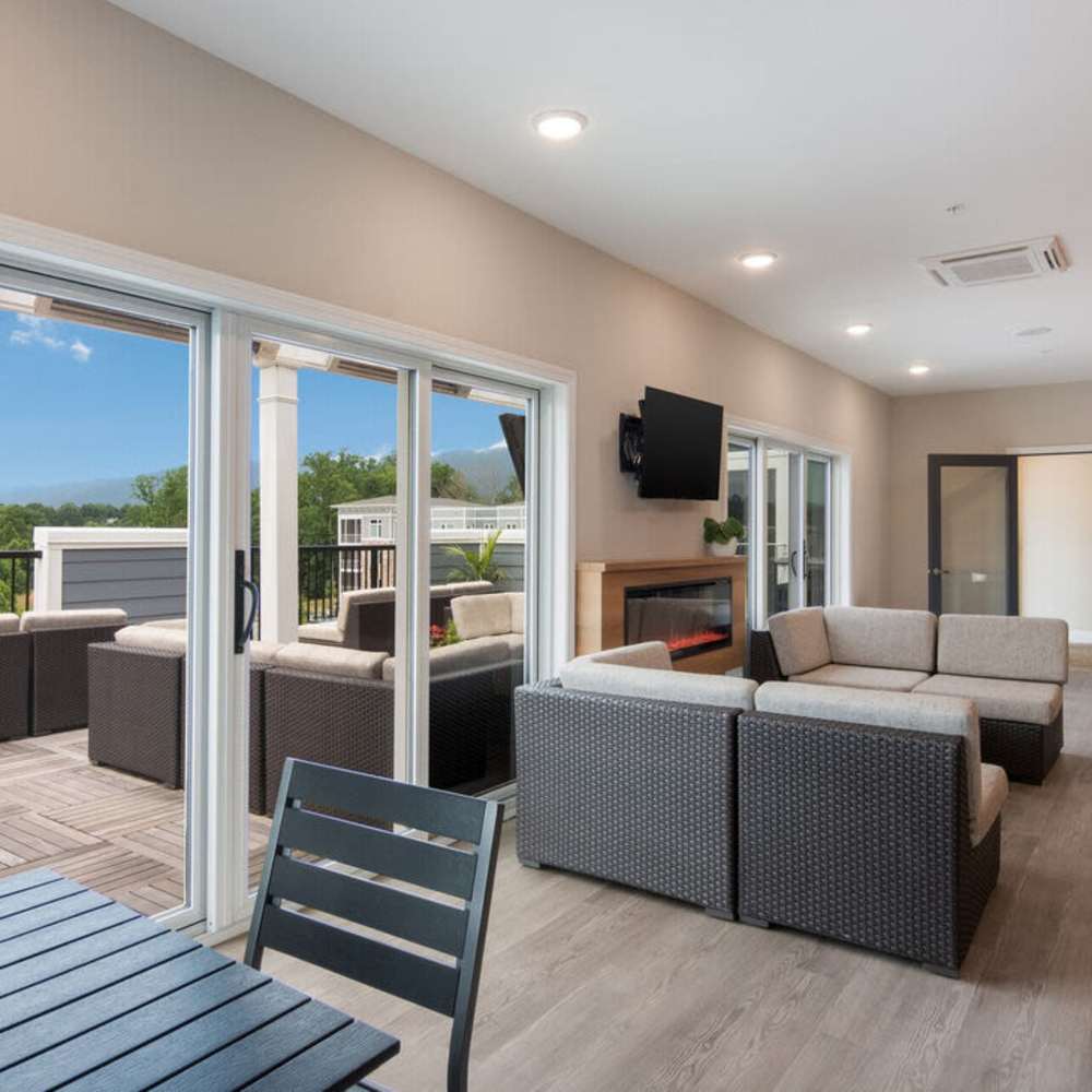 Clubhouse with a couch and a firepit at The Summit At Old Trail in Crozet, Virginia 