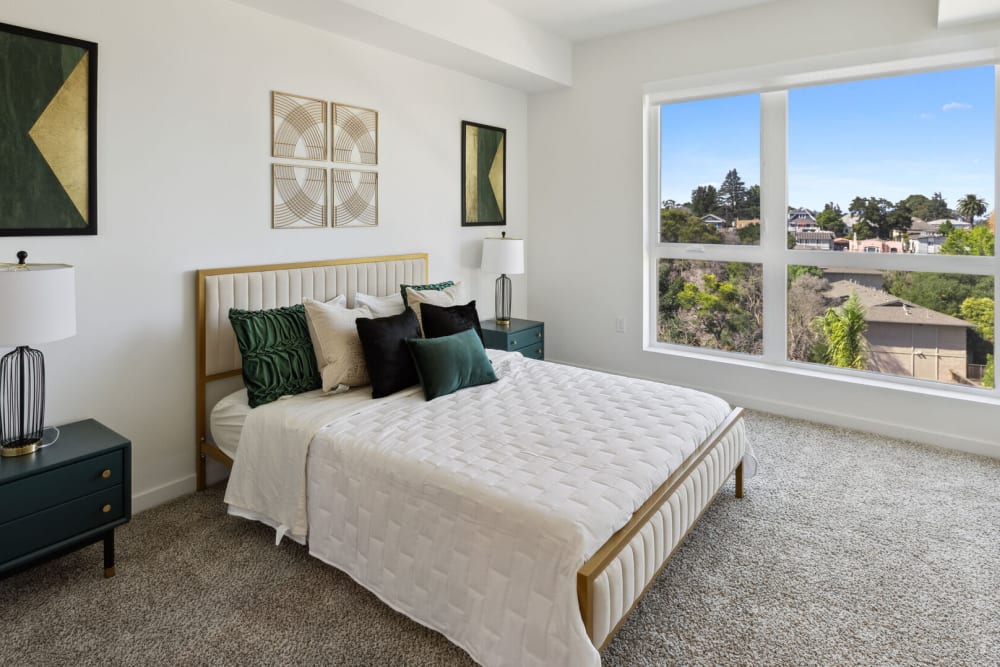 A large window in a cozy bedroom at Lincoln Landing in Hayward, California