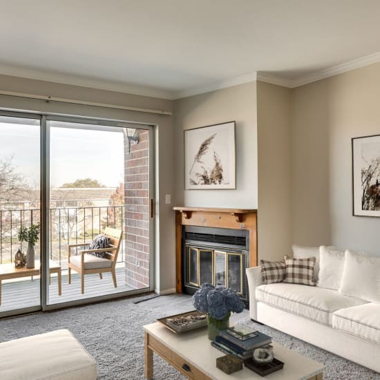 Comfortable couch in a furnished apartment living room at Huntington Apartments in Naperville, Illinois