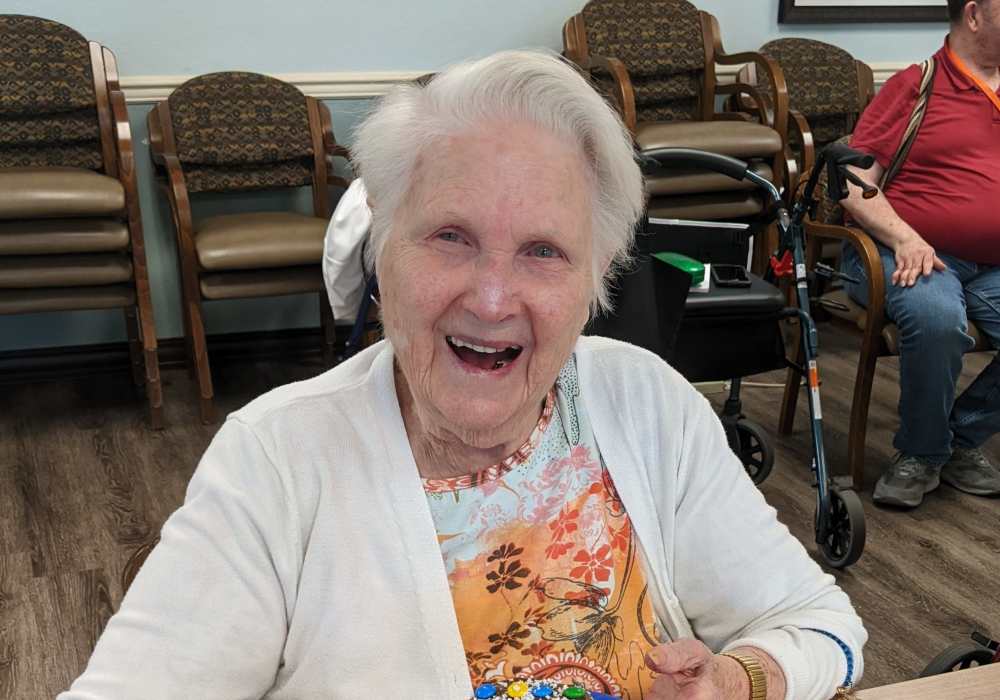 Resident excited to eat her meal at Truewood by Merrill, Clovis in Clovis, California