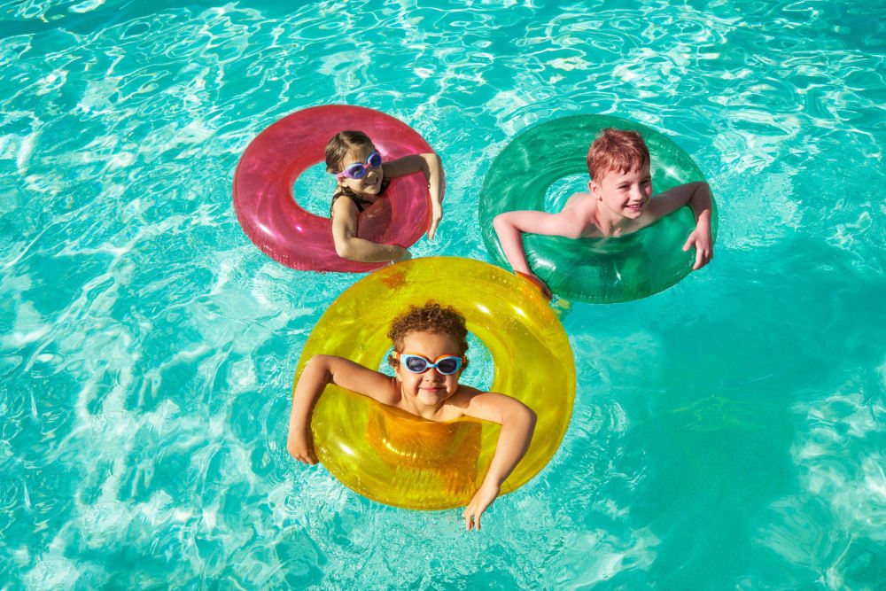 Kids floating in the pool at BB Living at Civic Square in Goodyear, Arizona