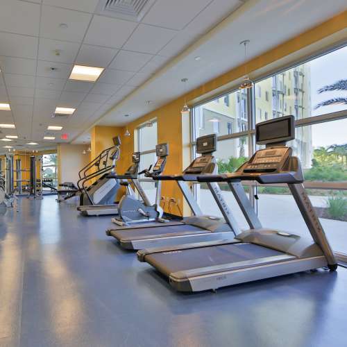 Fitness center with cardio equipment at Bayview Student Living in North Miami, Florida