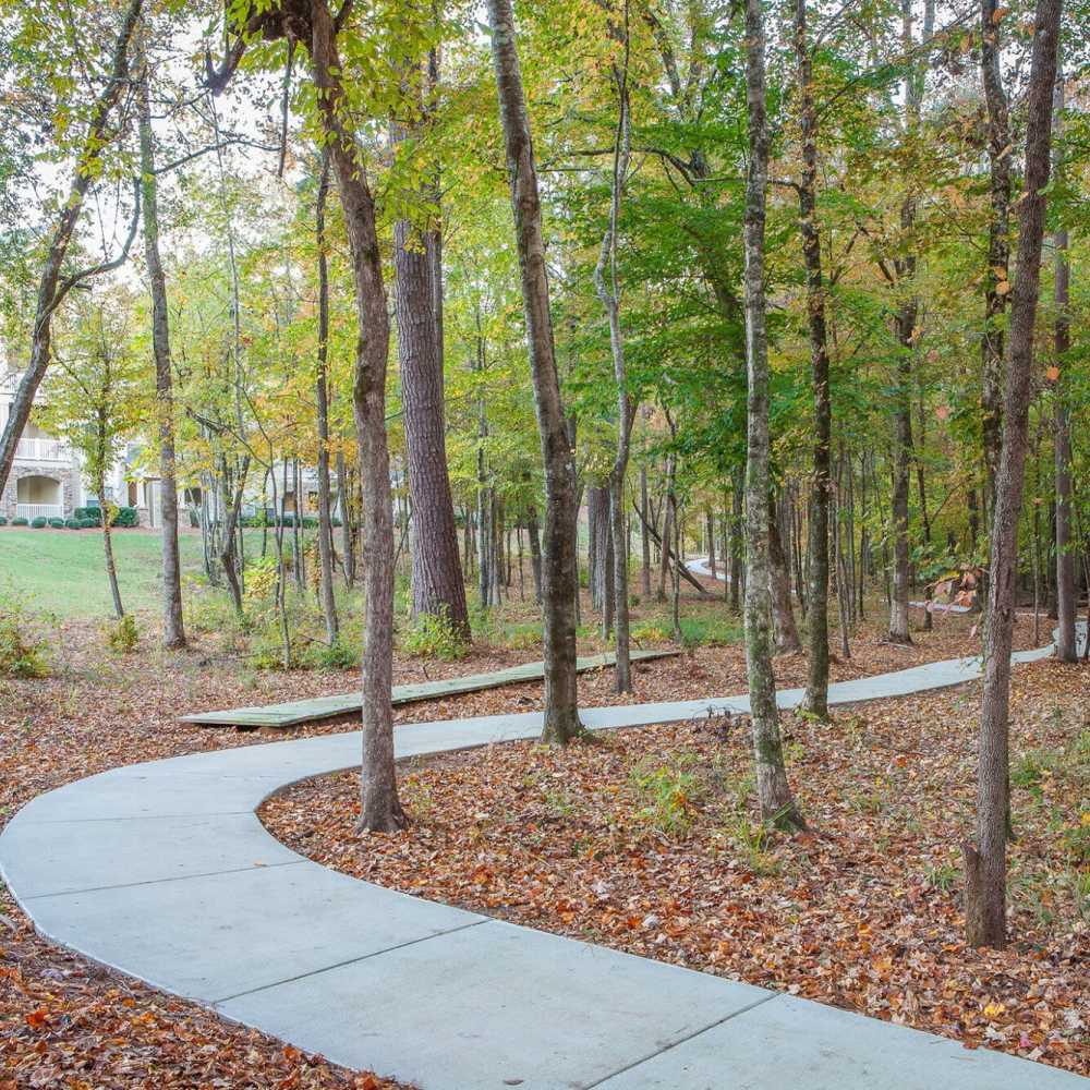 Walking trail with greenery at Preserve At Columbus Park in Columbus, Georgia