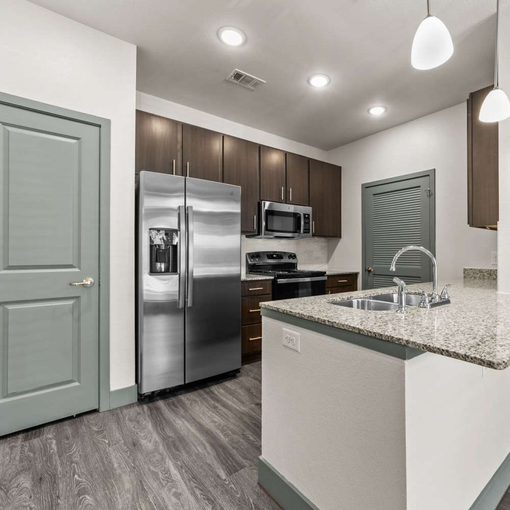 Modern kitchen at Cross Timbers Apartments in Greenville, Texas