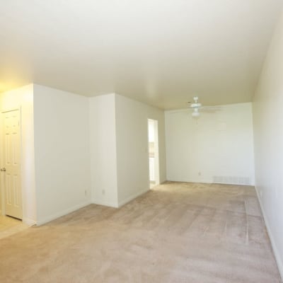 A well-lit living room in a home at South Mesa II in Oceanside, California