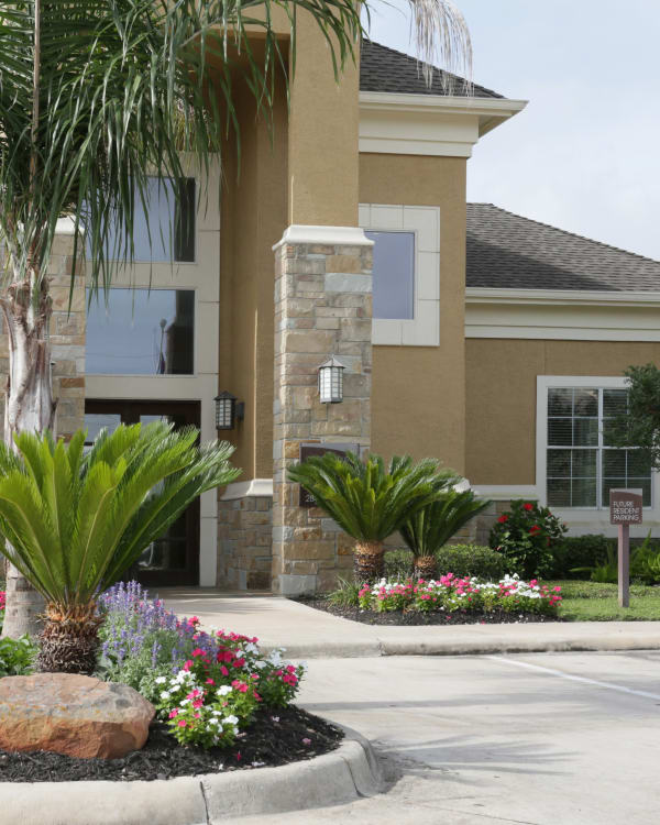 Clubhouse entrance near parking area at The Villas at River Park West