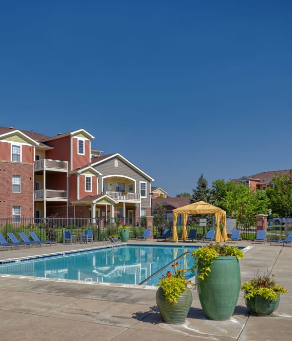 Swimming pool with lounges and cabanas at Bear Valley Park in Denver, Colorado