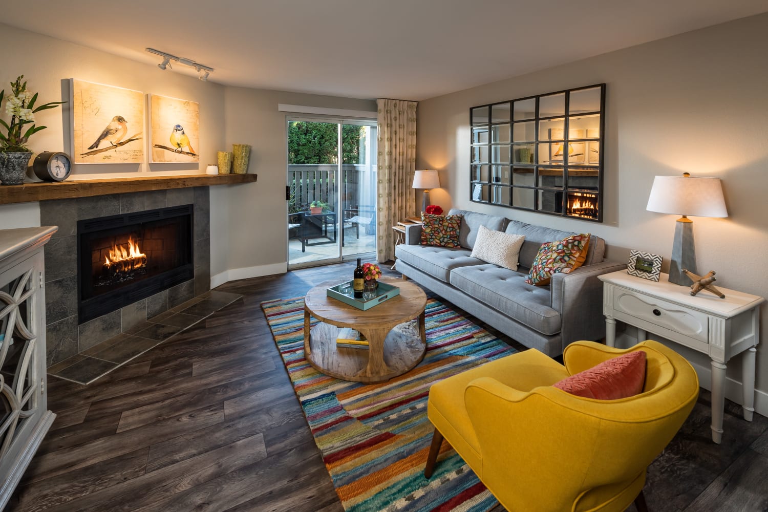 Large living room with fireplace at Campbell Run Apartments in Woodinville, Washington