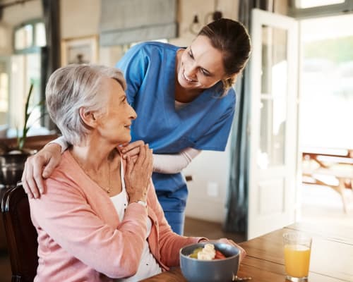 Caregiver checking on a resident at Liberty Arms Assisted Living in Youngstown, Ohio