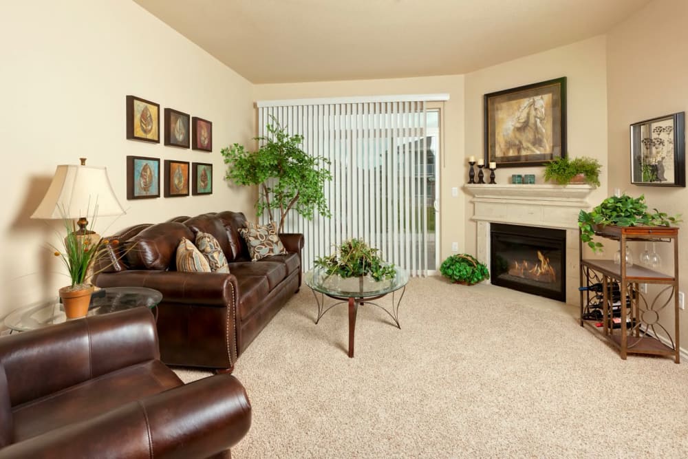 Living room with cozy fireplace at The Preserve at Greenway Park in Casper, Wyoming