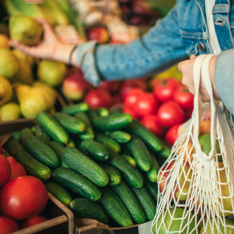 A resident shops for fresh produce near Acclaim at the Hill, Fredericksburg, Virginia