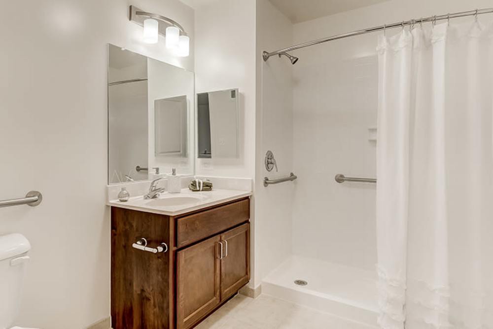 Modern bathroom with walk-in shower at Homes on Quaker Lane in Sandy Spring, Maryland