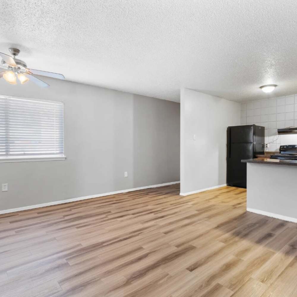 Living room with wood-style flooring and a fancy ceiling fan at Agave Courtyard in El Paso,Texas