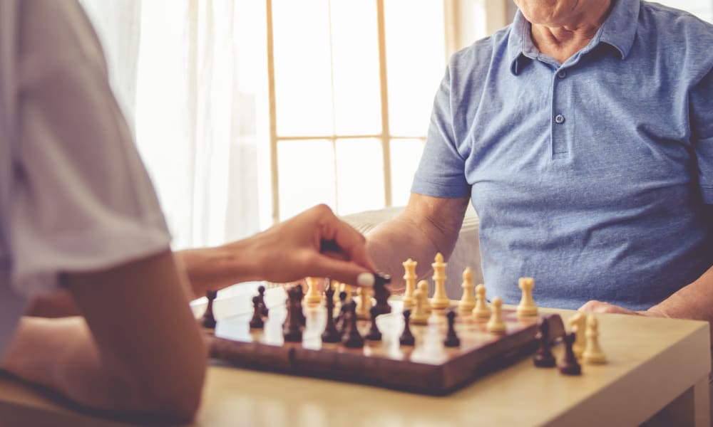 Resident playing chess at Randall Residence of Fremont in Fremont, Ohio