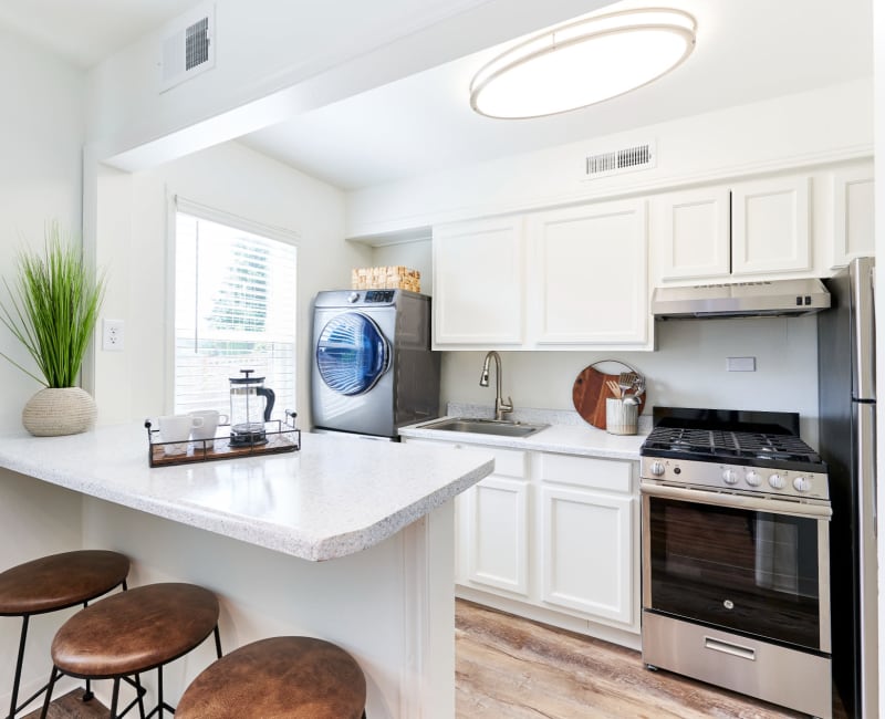 Model home kitchen with full range oven at Alcove at Seahurst in Burien, Washington