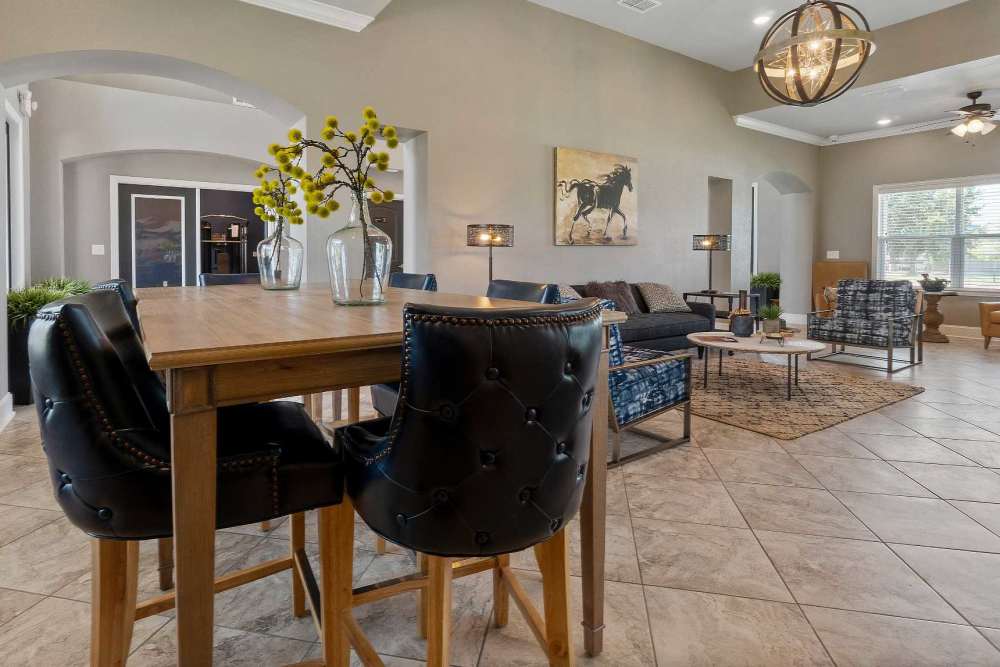 Dining space and lounge area of the clubhouse at Pine Creek in Paris, Texas