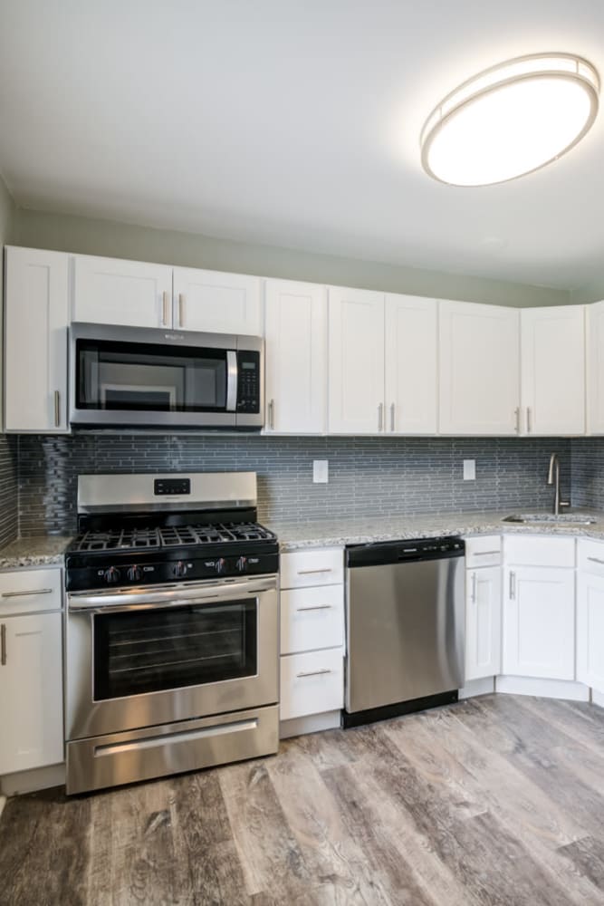Stainless steel appliance kitchen at Woodcrest Apartment Homes in Dover, Delaware