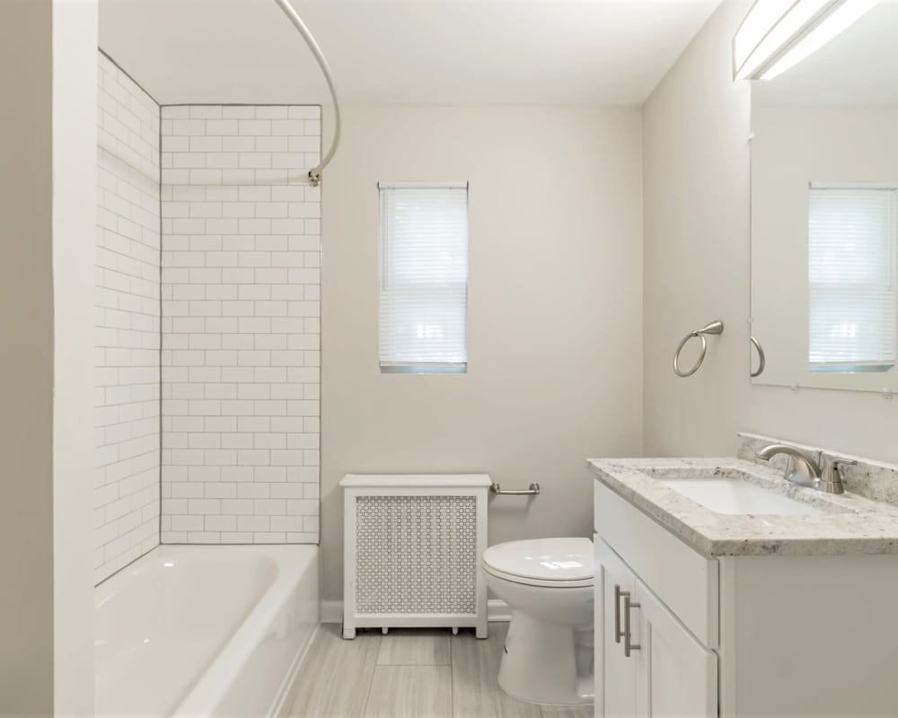 Bathroom with all white fixtures Eagle Rock Apartments at Maplewood in Maplewood, New Jersey