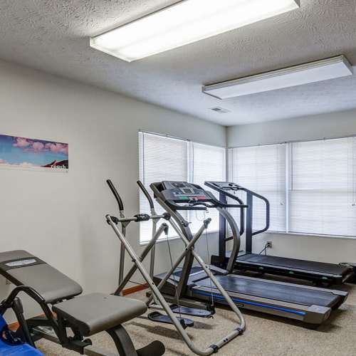 Fitness center with equipment at Oakmont Greene I in Mount Hope, West Virginia