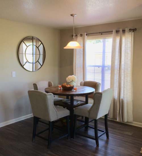 Round dining table with hanging light at The Reserve at Kanapaha in Gainesville, Florida