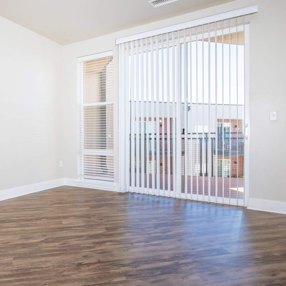 Unfurnished living room with access to patio at Park Place Olde Town Apartments in Arvada, Colorado