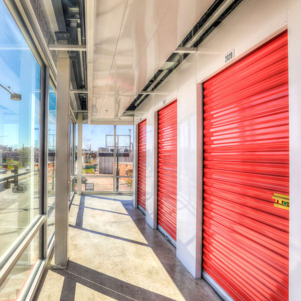 Indoor storage units with red doors at StorQuest Self Storage in Chula Vista, California