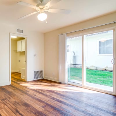 An spacious living room with wood floors at O'Neill Heights in Oceanside, California