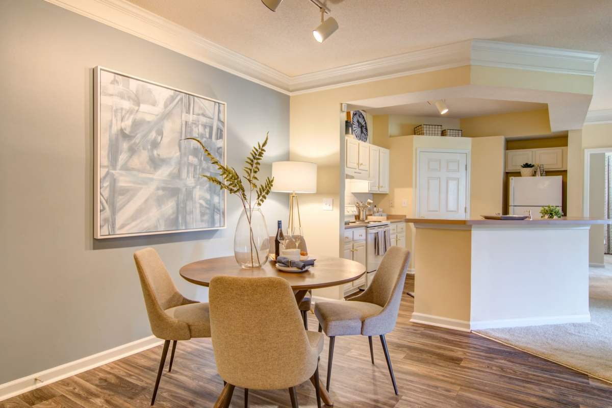 Dining room with table and close access to kitchen at Alta Mill Apartments, Austell, Georgia