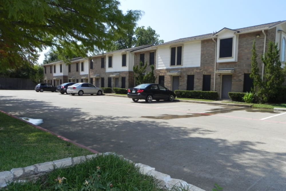 View of the exterior from parking lot at Highlands of Grand Prairie in Grand Prairie, Texas