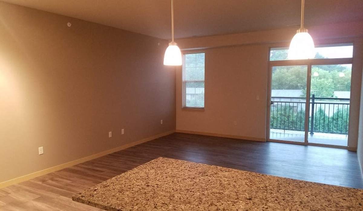 Spacious apartment extending to the balcony at Mill Creek Apartments in Cross Plains, Wisconsin