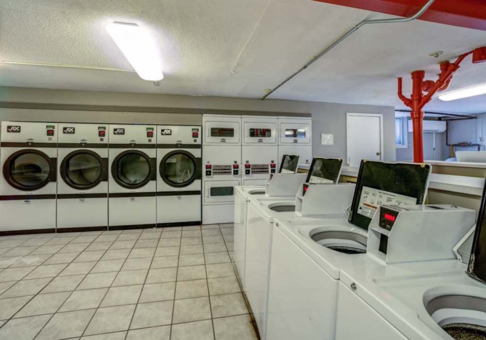 Washer and dryer facility at Courtyard Apartments in Columbia,Missouri