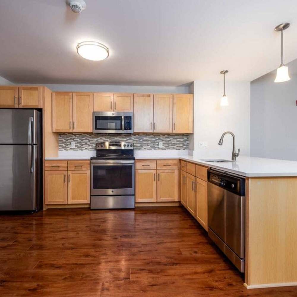Modern kitchen with stainless-ateel appliances at Mount Hope Lofts in Rochester, New York