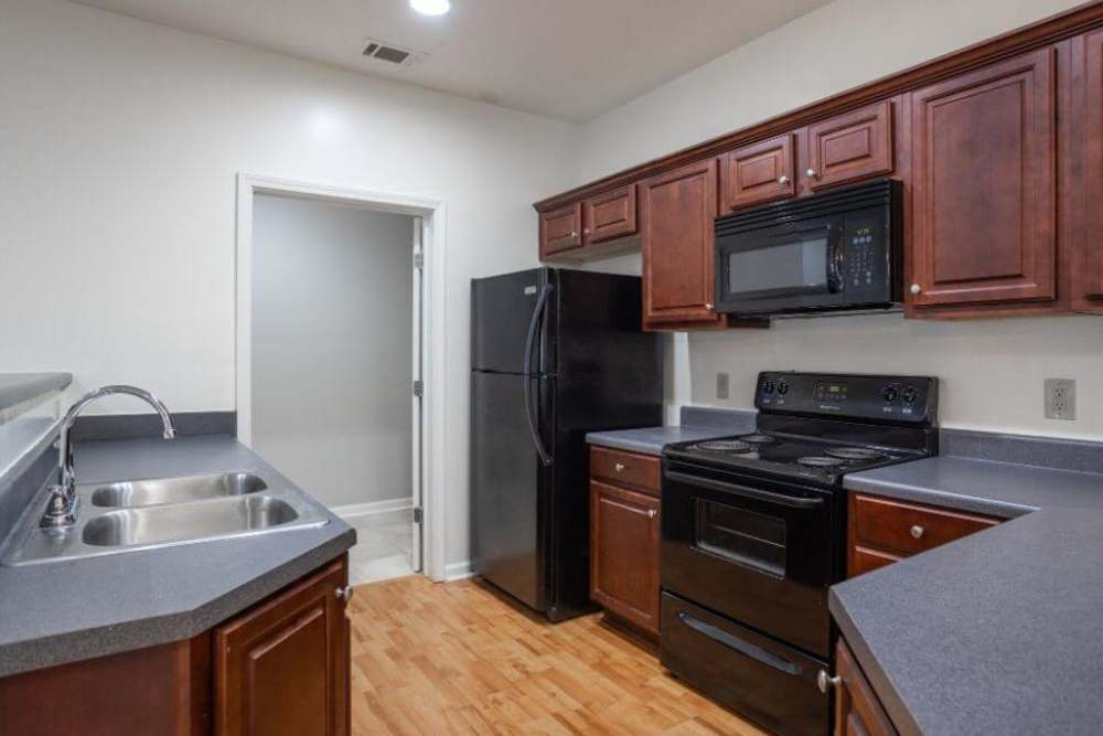 Fully equipped kitchen with appliances at Orchard Trace Lagrange in Lagrange, Georgia