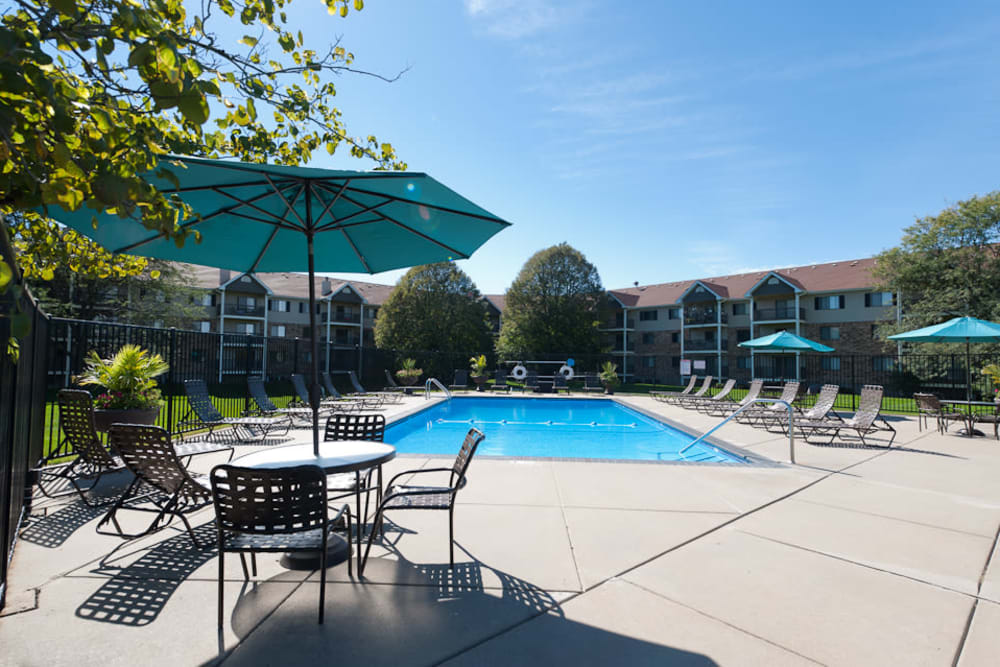 Outdoor pool with sundeck at Pointe West Apartment Homes in West Des Moines, Iowa