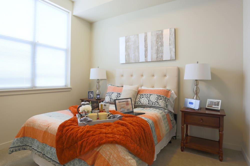 Brightly lit large bedroom in apartment at The Lofts at Glenwood Place in Vancouver, Washington