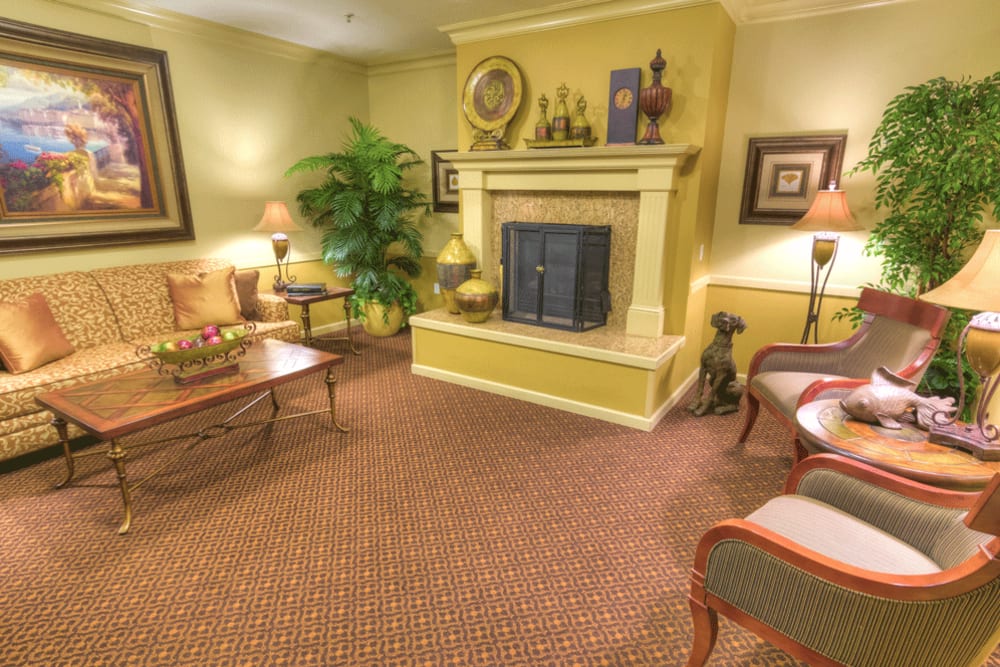 Comfortable and cozy fireside lounge at The Meadows - Assisted Living in Elk Grove, California