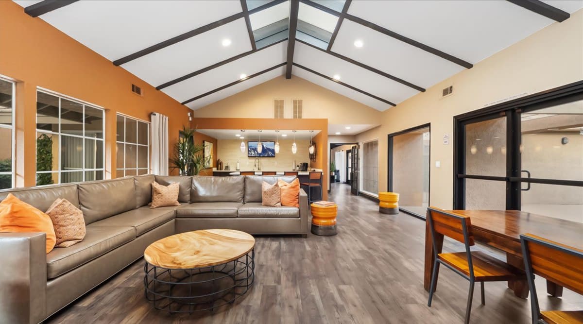 Clubhouse with L-shaped sofa at  Mirabella Apartments in Bermuda Dunes, California