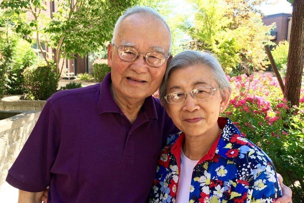 Happy resident couple at Merrill Gardens at The University in Seattle, Washington. 