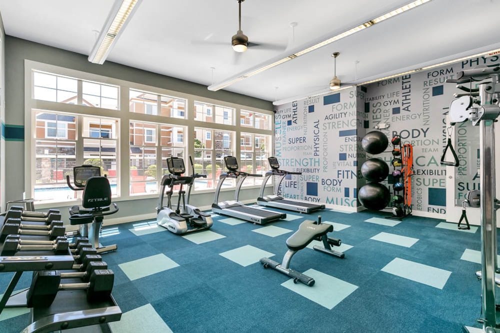 Fitness center with plenty of individual workout stations at Crestone Apartments in Aurora, Colorado