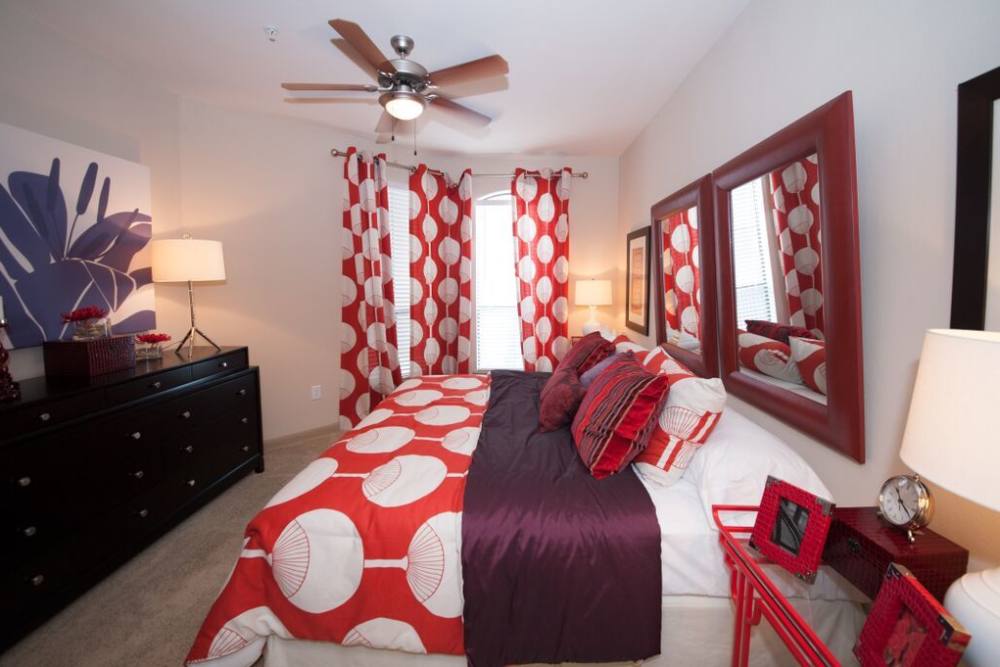 Modern bedroom with large comfortable bed at Forum on San Felipe in Houston, Texas