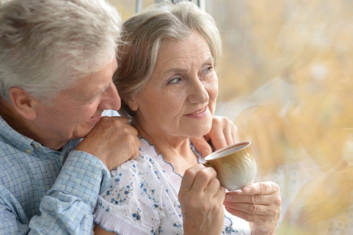 Two residents looking out a window at Avenir Senior Living in Scottsdale, Arizona