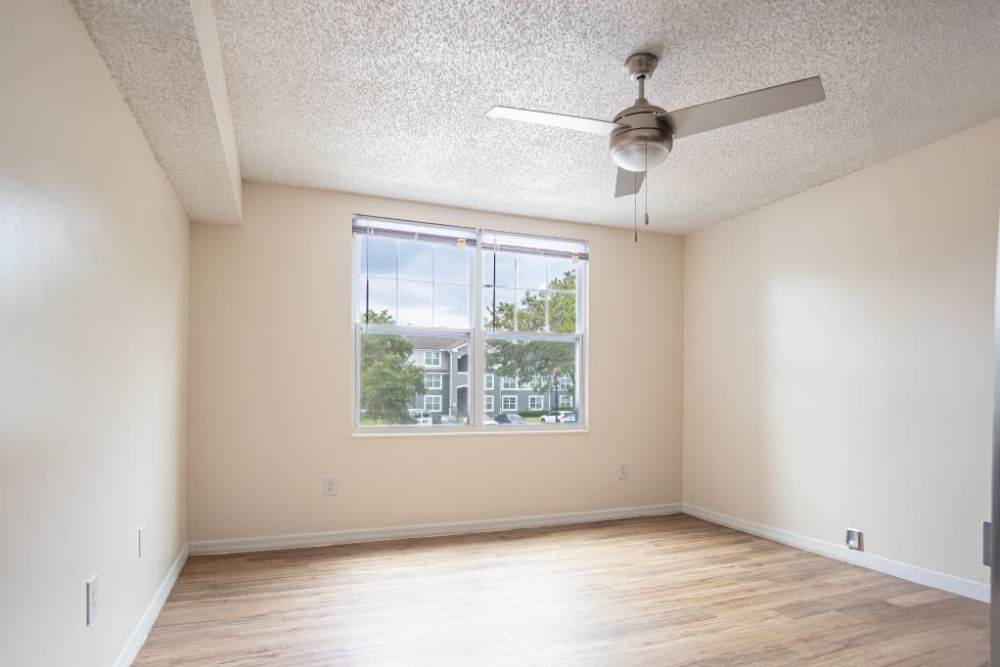Unfurnished bedroom with ceiling fan at Logan Heights in Sanford, Florida