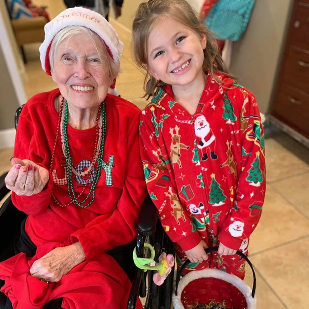 A resident and granddaughter celebrating the holiday at Inspired Living Ivy Ridge in St Petersburg, Florida.