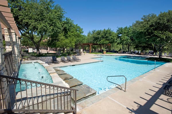 Outdoor swimming pool at Villas of Preston Creek in Plano, Texas