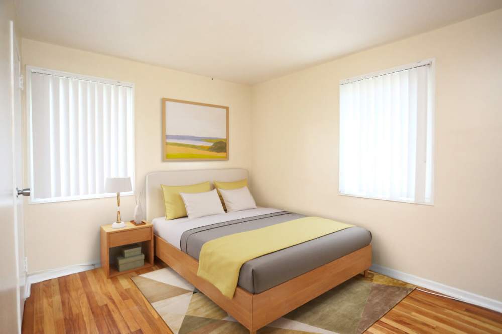 Bedroom with large bed and windows at Central Park in Park Forest,Illinois